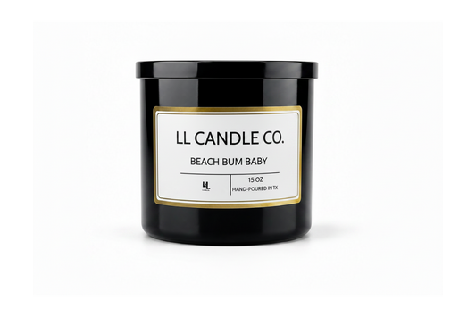A 15 oz hand-poured soy candle in a matte black glass jar by LL Candle Co., featuring a white label with a gold border and black text on a clean white background.