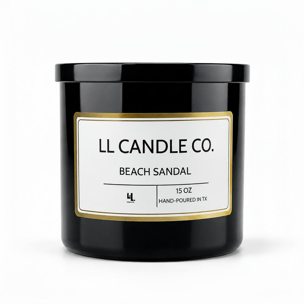 A black glass jar candle with a white label and gold border, reading 'LL CANDLE CO. BEACH SANDAL' on a clean white background.