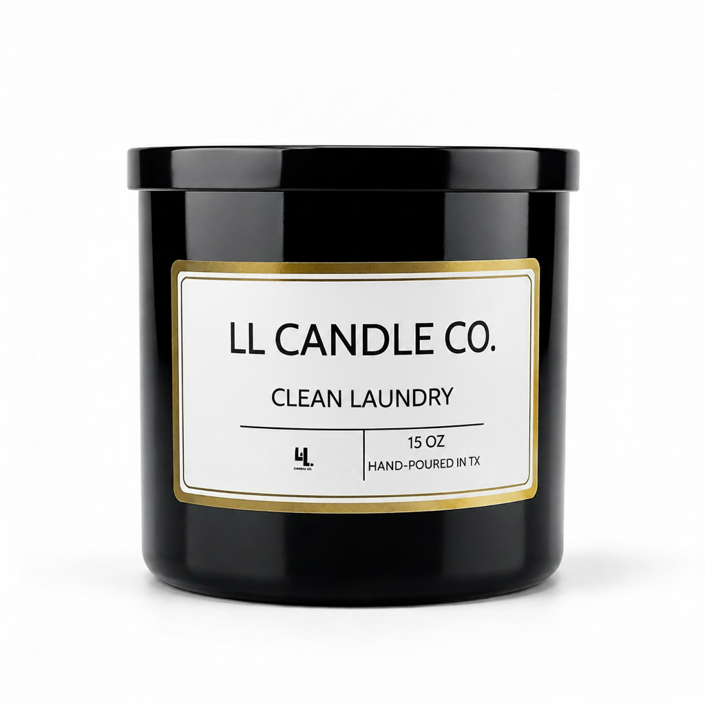 A black glass jar candle with a white label and gold border, labeled 'LL CANDLE CO. CLEAN LAUNDRY' on a clean white background.