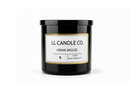 A black glass jar candle with a white label and gold border, labeled 'LL CANDLE CO. CRÈME BRÚLÉE', on a clean white background.