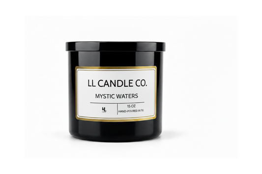 A black glass jar candle with a white label and gold border, featuring the brand name 'LL CANDLE CO.' and scent name 'MYSTIC WATERS' on a clean white background.