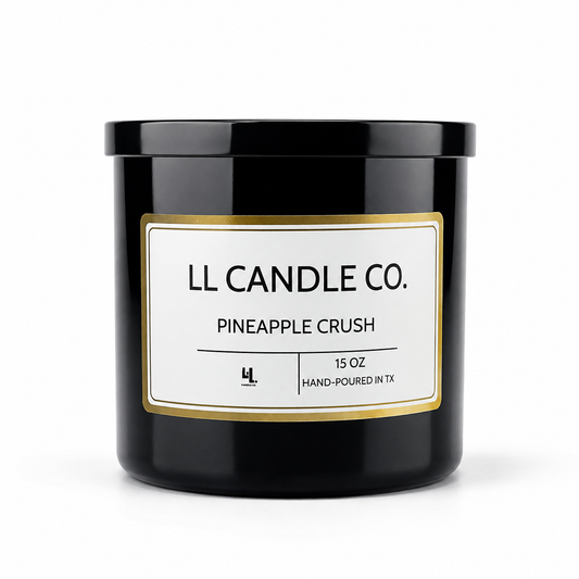 A black glass jar candle with a white label and gold border, reading 'LL CANDLE CO. PINEAPPLE CRUSH' on a clean white background.