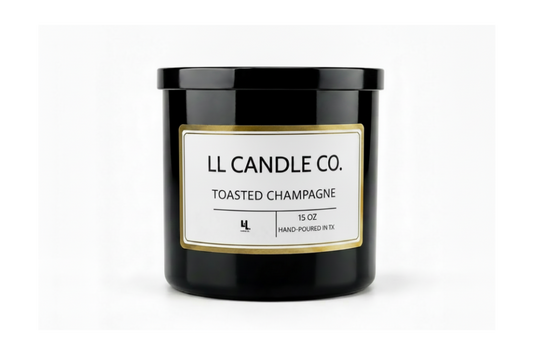 A black glass jar candle with a black lid and a white label featuring gold trim. The label reads 'LL CANDLE CO.